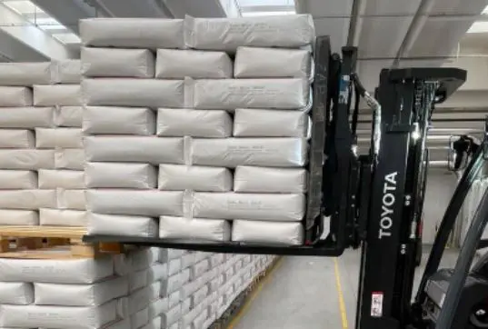 Forklift lifting heavy consumer goods using Slip Sheets